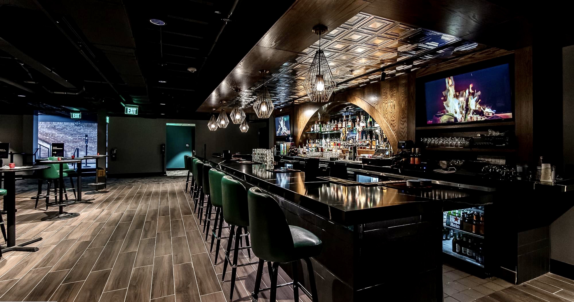 Upscale bar with pressed tin ceiling custom wood archway built by Hatley Construction